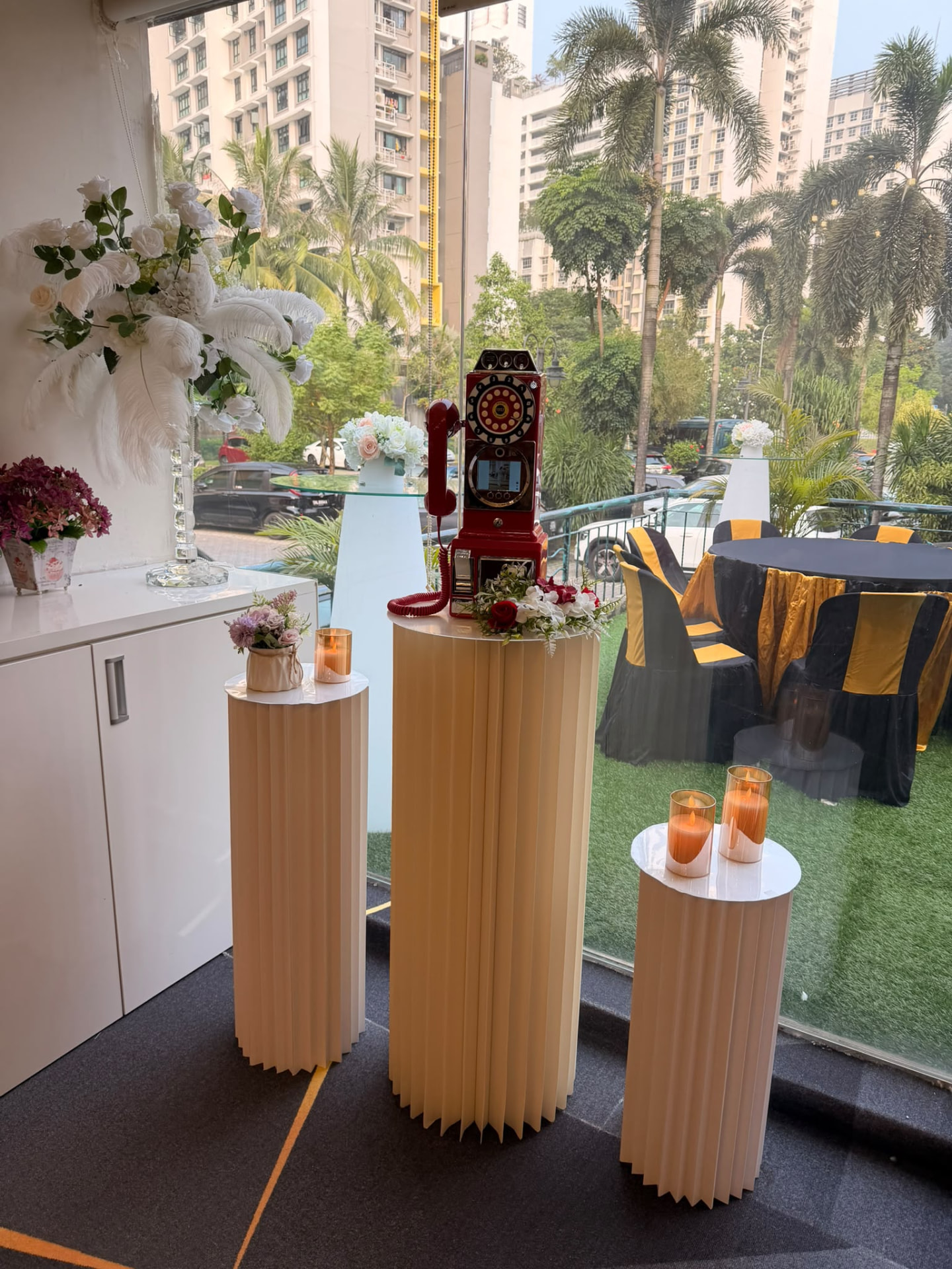 Real red phone video guest book on a decorated stand at an event