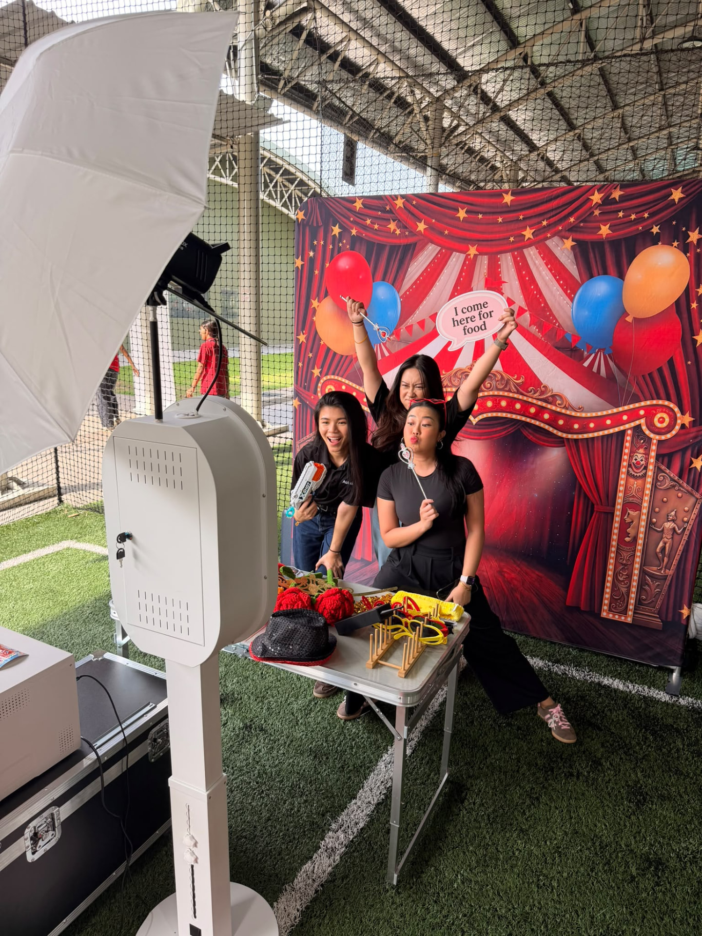 Guests posing with props at a real photobooth event